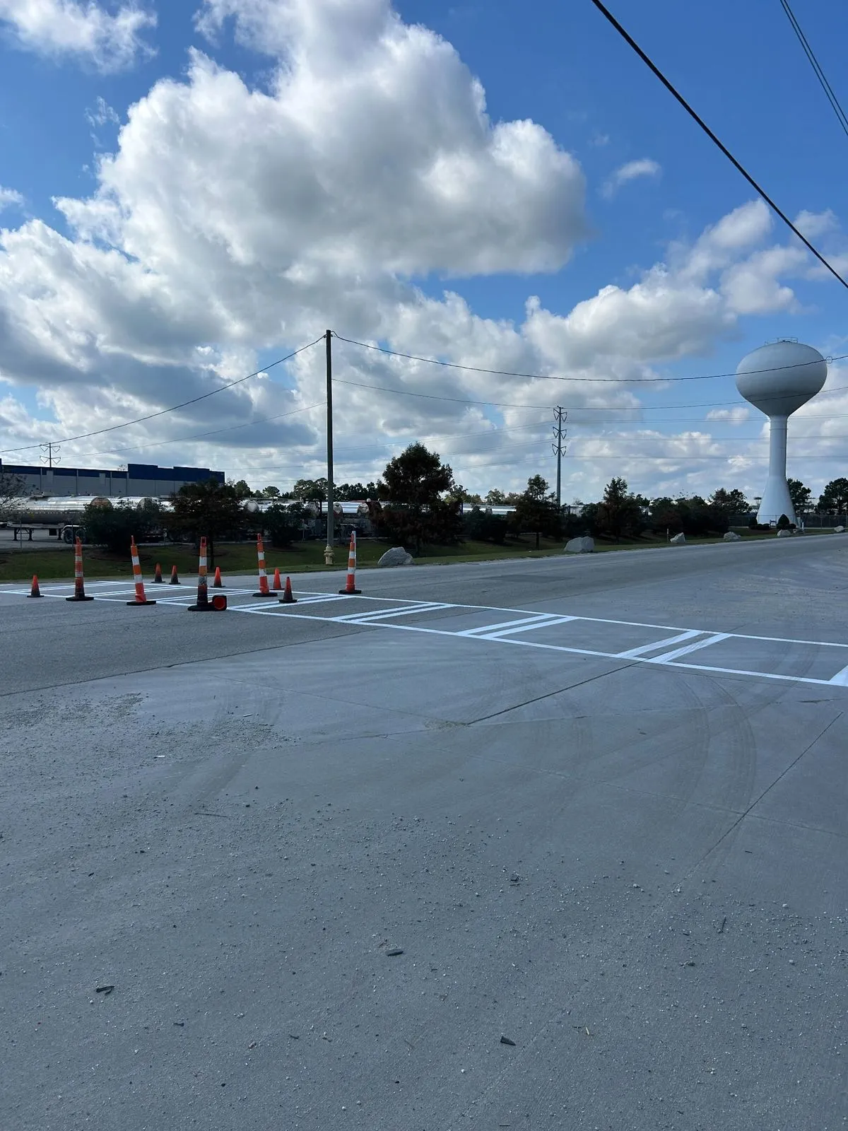 New crosswalk and stop bar markings on fresh concrete