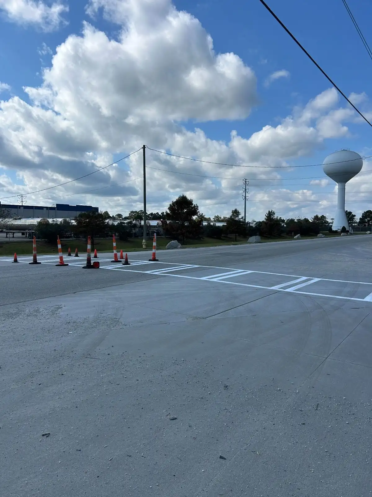 New crosswalk and stop bar markings on fresh concrete