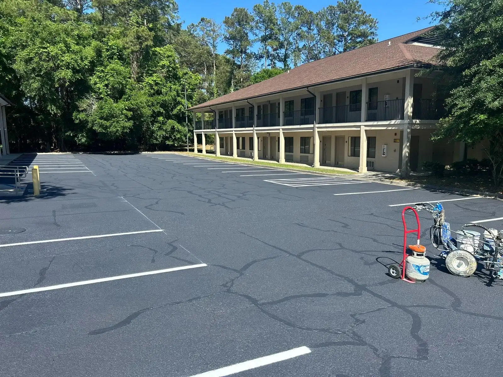 PPS line striping machine on a commercial parking lot