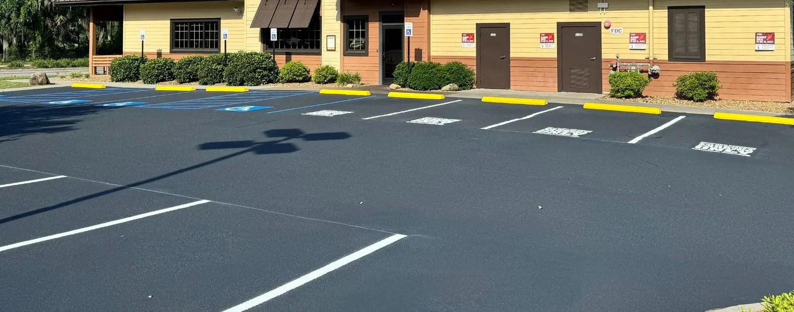 Restaurant parking lot after sealcoating and restriping